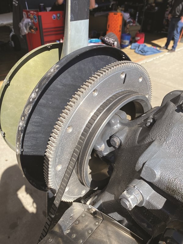 Close-up of a Piper aircraft v-belt, with round mechanical features and gears, for the air conditioning unit.